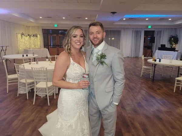 A wedding couple standing together on the dance floor