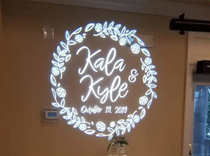 Custom Kala and Kyle wedding name projection on a venue wall
