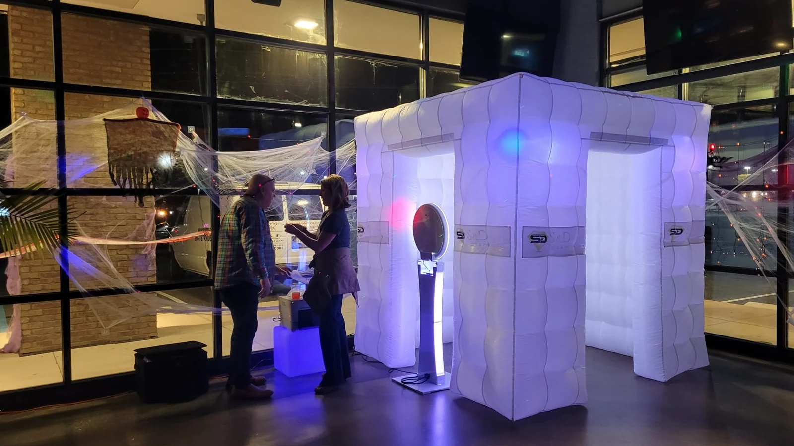 S and D illuminated inflatable photo booth and camera station at a real event