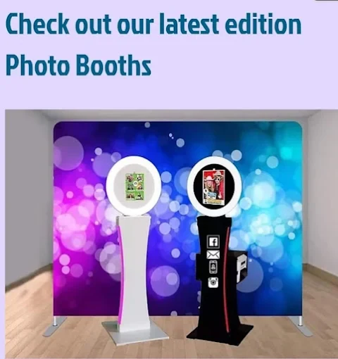 White and black photo booth stations with a colorful backdrop